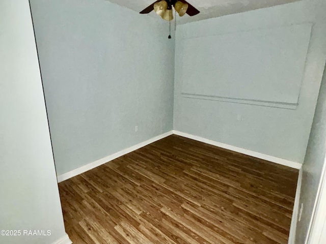 empty room with ceiling fan and dark hardwood / wood-style floors