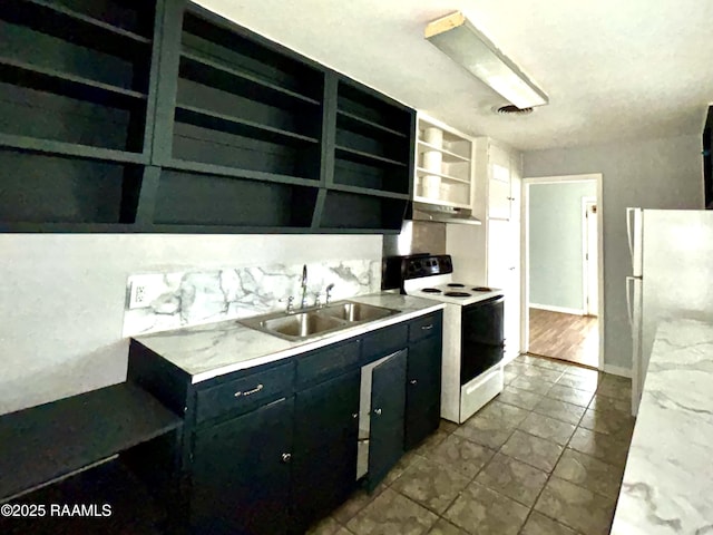 kitchen with built in shelves, light stone counters, sink, and white appliances