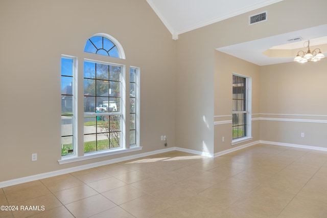 unfurnished room featuring light tile patterned floors, a wealth of natural light, crown molding, and a notable chandelier