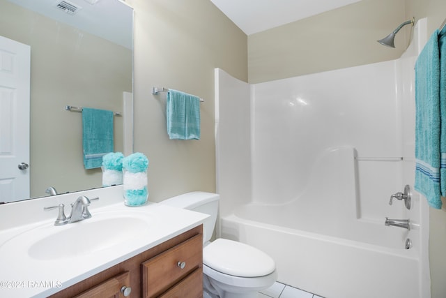 full bathroom with toilet, vanity, tile patterned floors, and  shower combination