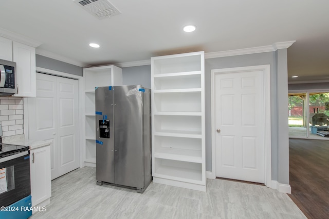 kitchen featuring backsplash, electric range oven, light hardwood / wood-style flooring, white cabinets, and stainless steel fridge with ice dispenser