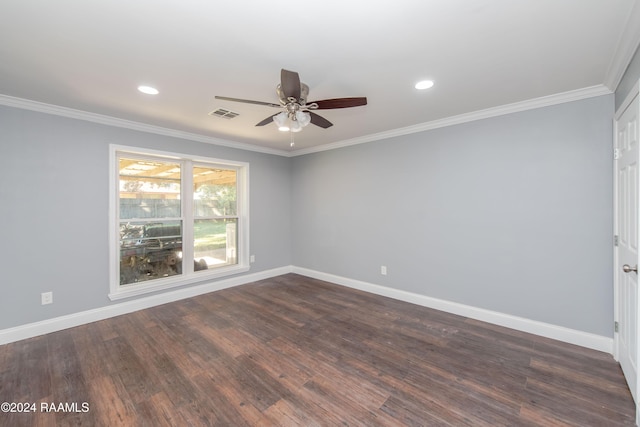 empty room featuring ornamental molding, ceiling fan, and dark wood-type flooring