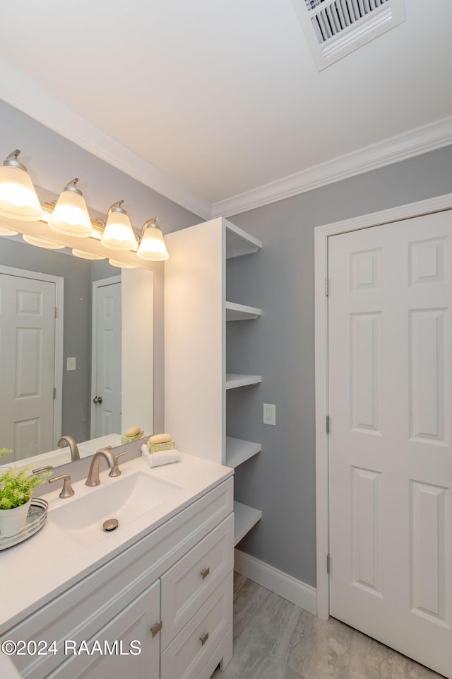 bathroom with vanity, hardwood / wood-style flooring, and ornamental molding