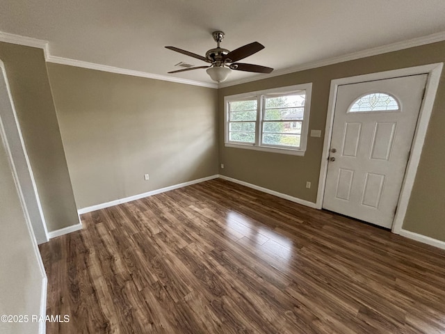 entrance foyer featuring ceiling fan, dark wood-type flooring, and ornamental molding