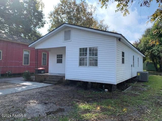 back of house with a patio and cooling unit