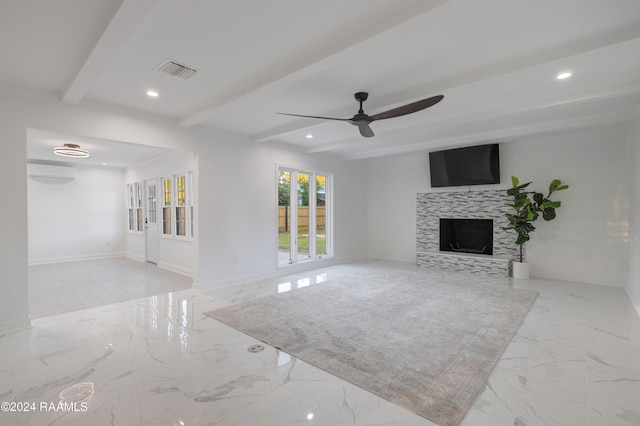 living room with beam ceiling, a tiled fireplace, ceiling fan, and a wall mounted AC