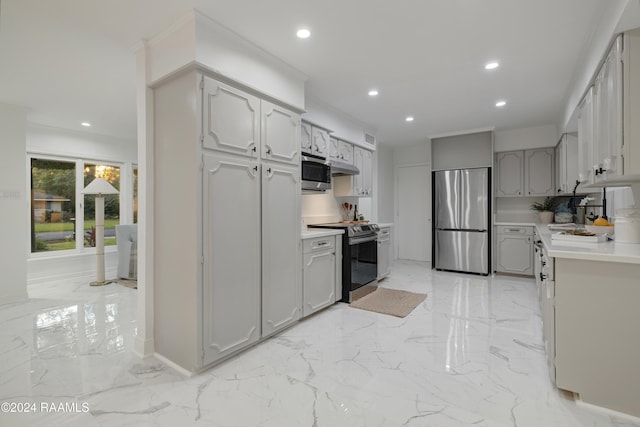 kitchen featuring gray cabinetry and appliances with stainless steel finishes