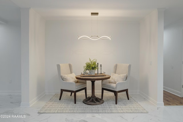 sitting room with ornamental molding