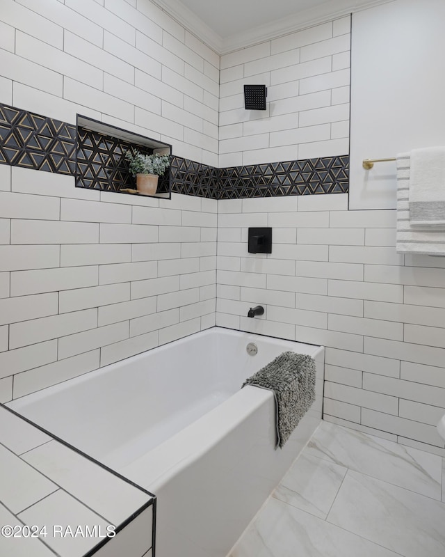 bathroom with shower / bathing tub combination, ornamental molding, and tile walls