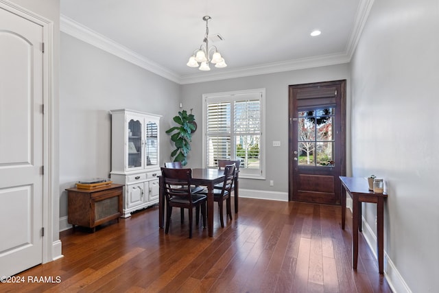 dining space featuring dark hardwood / wood-style flooring, a chandelier, and ornamental molding