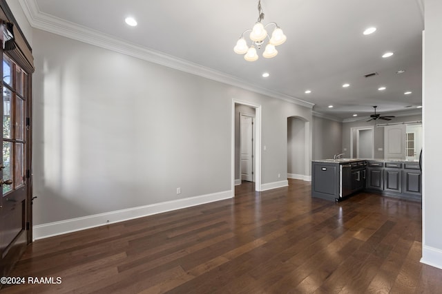 kitchen with ceiling fan with notable chandelier, sink, crown molding, dark hardwood / wood-style floors, and kitchen peninsula