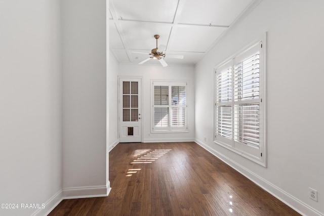 spare room with ceiling fan, coffered ceiling, and dark hardwood / wood-style floors