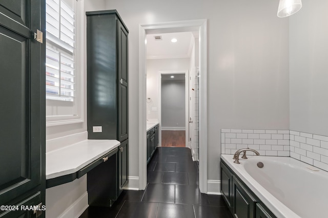 bathroom with a tub to relax in, crown molding, and vanity