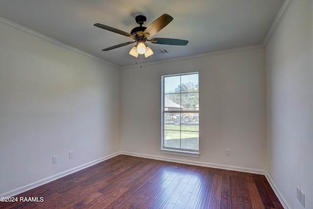 spare room featuring ceiling fan, dark hardwood / wood-style flooring, and ornamental molding