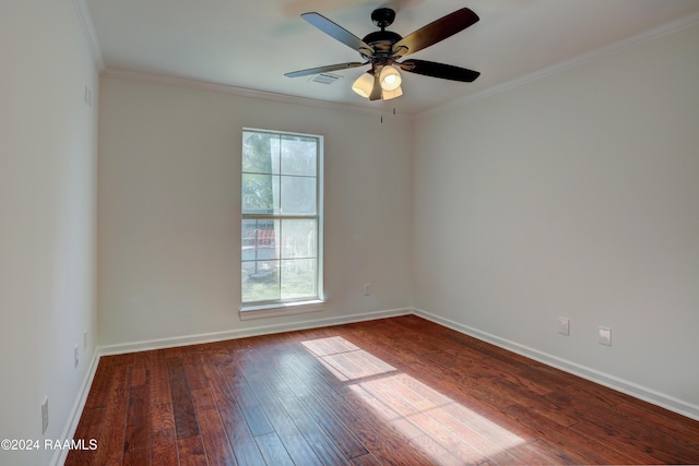 spare room featuring hardwood / wood-style floors, plenty of natural light, crown molding, and ceiling fan