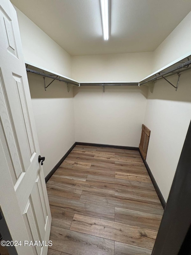 701 S College Rd Unit 307, Lafayette, LA 70503 - walk in closet with light wood-style floors