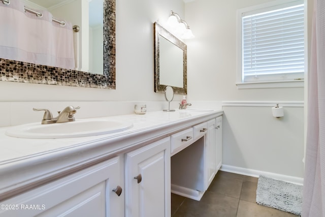 bathroom with tile patterned floors and vanity