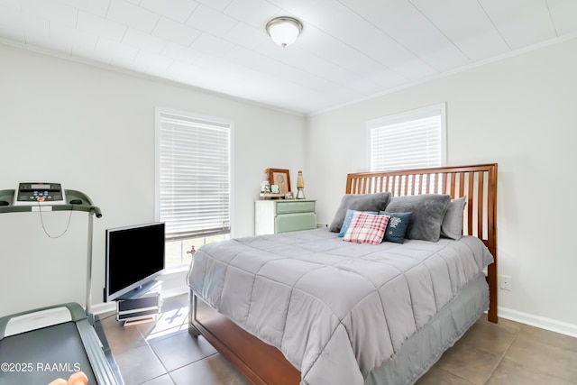 tiled bedroom with ornamental molding