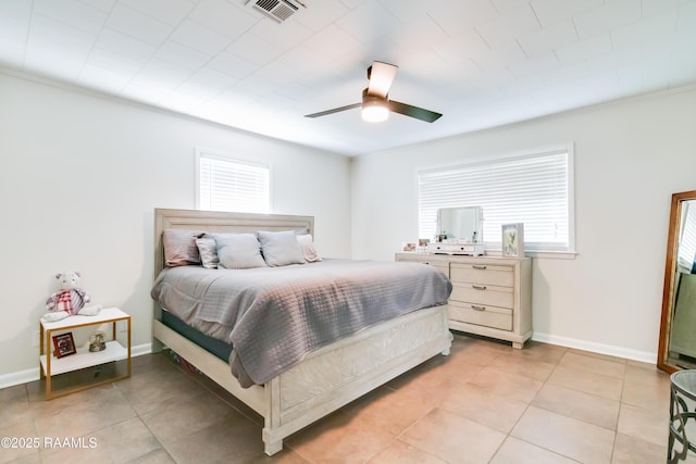 tiled bedroom with ceiling fan