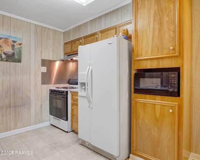 kitchen with white appliances, ornamental molding, and wood walls