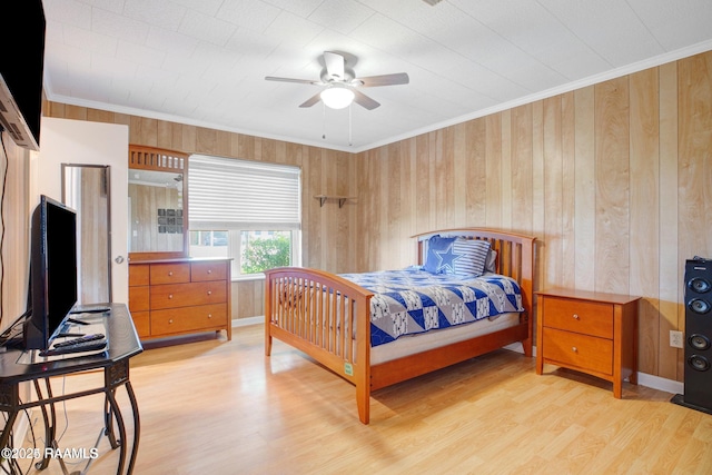 bedroom with ceiling fan, light wood-type flooring, and ornamental molding