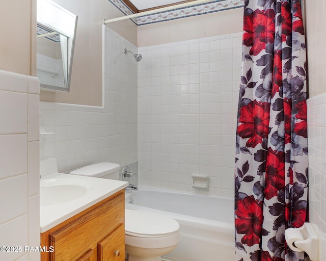 full bathroom with shower / tub combo, vanity, tile walls, and toilet