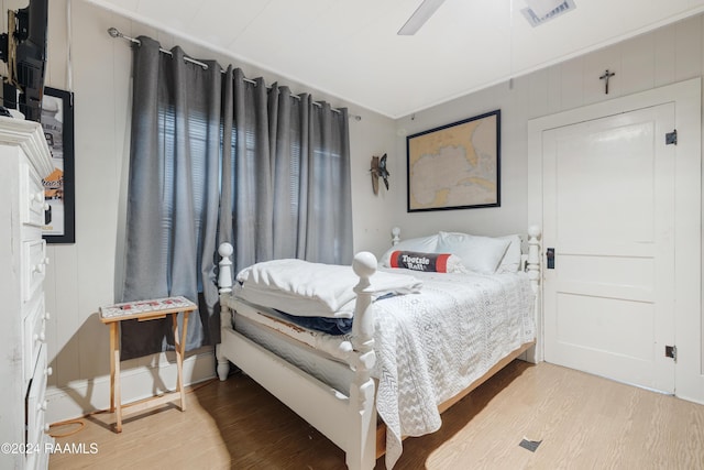 bedroom featuring hardwood / wood-style floors and ceiling fan
