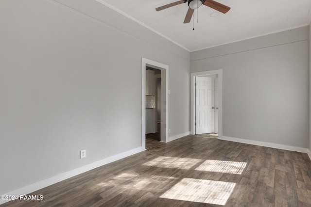 spare room with ceiling fan, dark hardwood / wood-style flooring, and crown molding