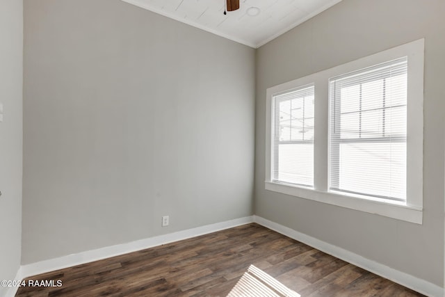 spare room featuring dark hardwood / wood-style floors, ceiling fan, and ornamental molding