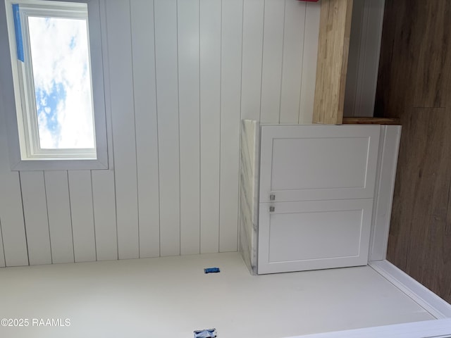 interior space featuring wood walls and plenty of natural light