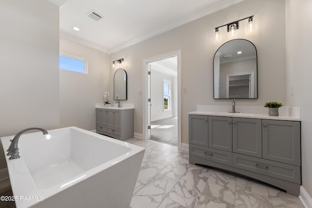 full bathroom featuring marble finish floor, a sink, visible vents, and crown molding