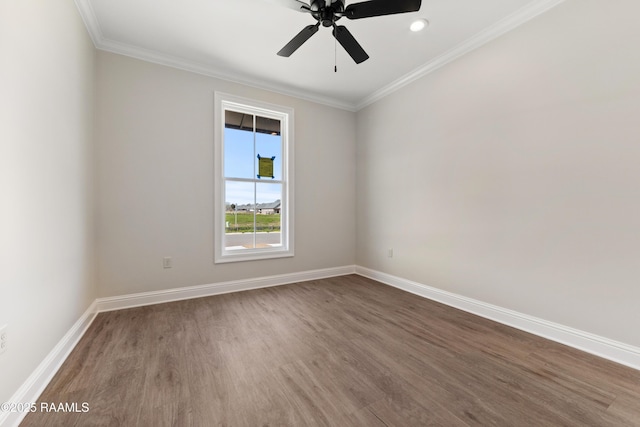 unfurnished room with ceiling fan, ornamental molding, wood finished floors, and baseboards