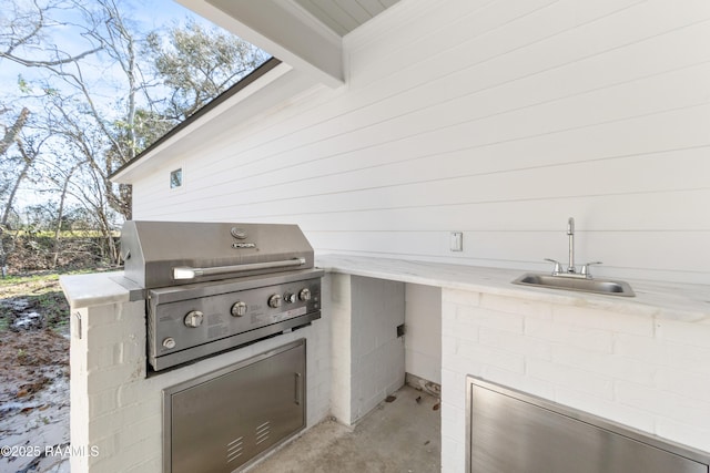 view of patio / terrace with area for grilling, grilling area, and a sink