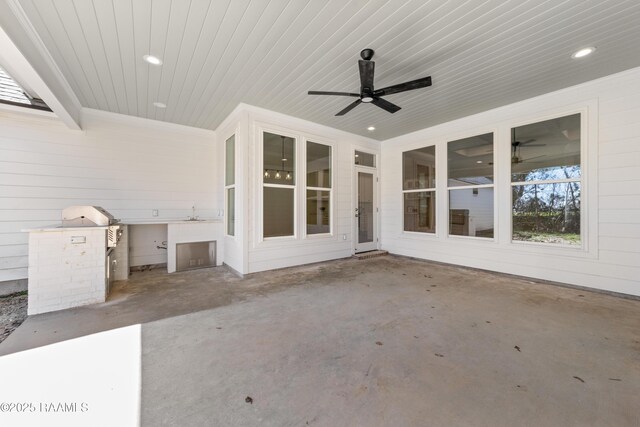 view of patio featuring a grill and a ceiling fan