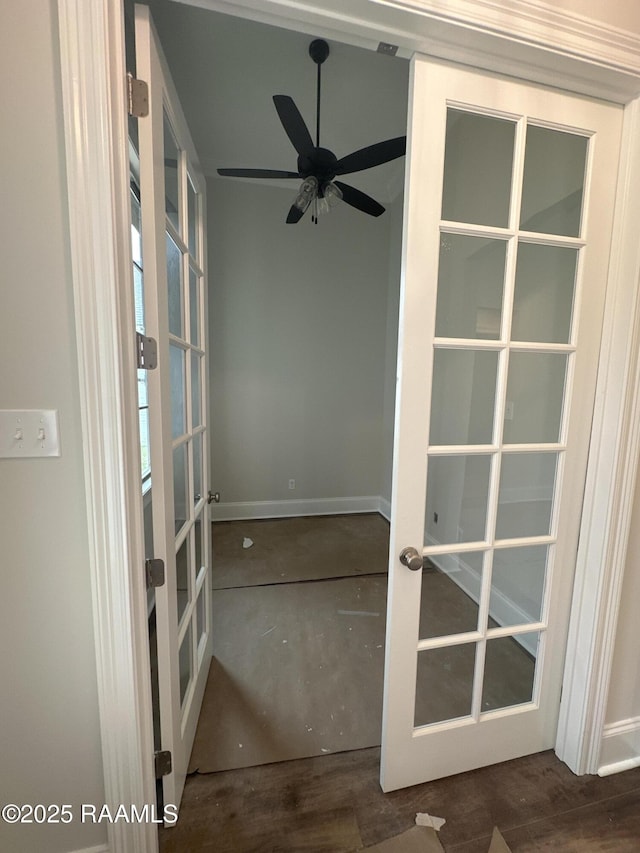 interior space with french doors, ceiling fan, and dark hardwood / wood-style flooring