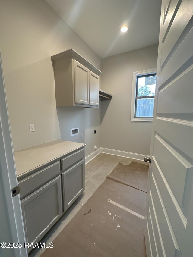 laundry room with washer hookup, cabinets, and electric dryer hookup