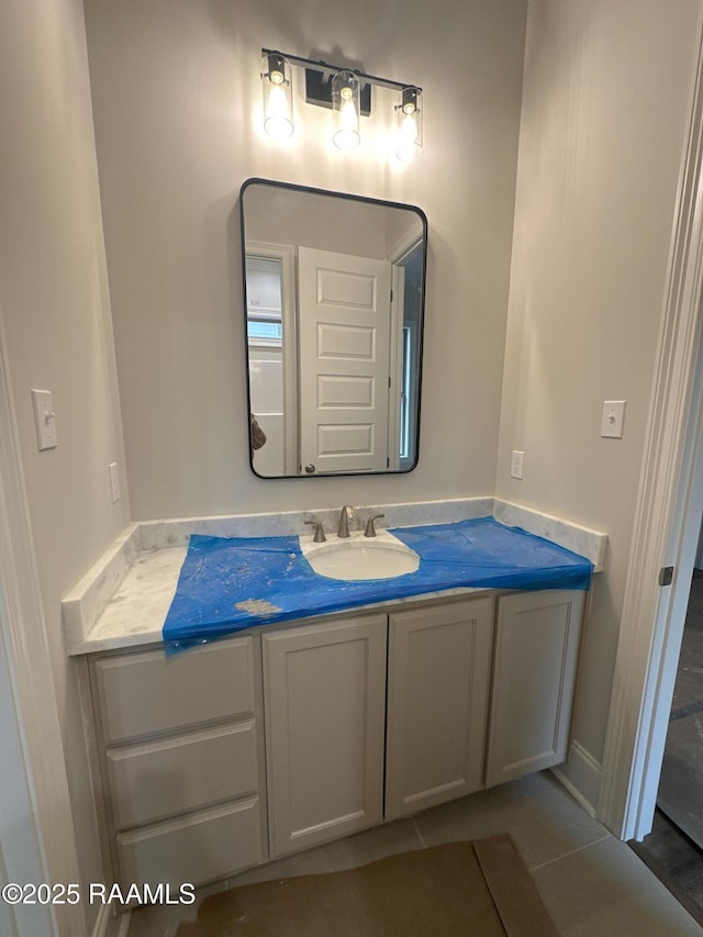 bathroom with vanity and tile patterned floors