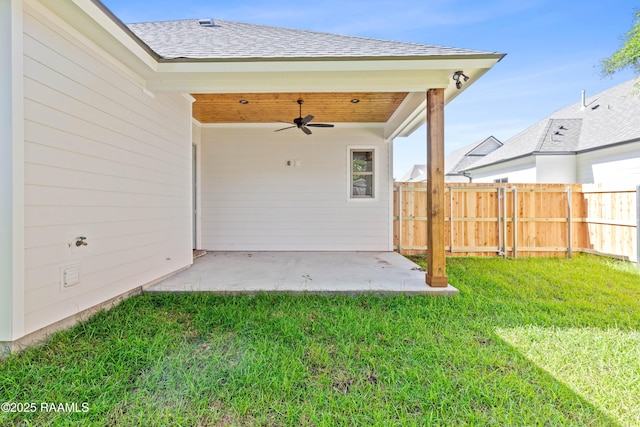 view of yard featuring a patio, ceiling fan, and fence