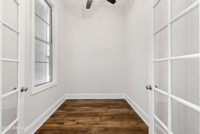 interior space with baseboards, dark wood-style flooring, ceiling fan, and french doors