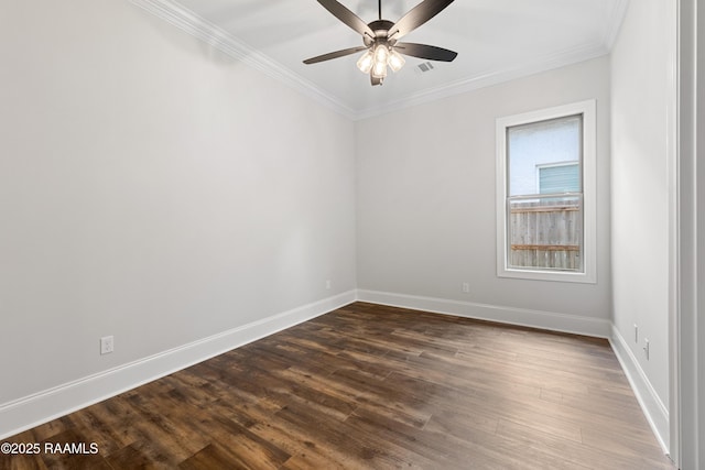 unfurnished room featuring crown molding, dark wood finished floors, a ceiling fan, baseboards, and visible vents