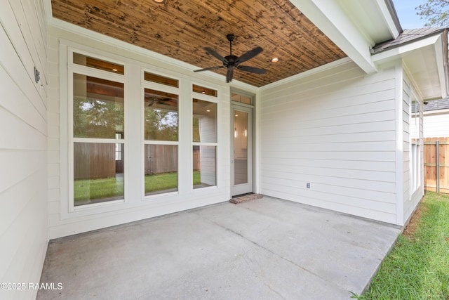view of patio / terrace featuring fence and ceiling fan