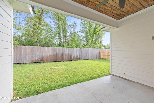 view of yard with a patio area, a fenced backyard, and a ceiling fan