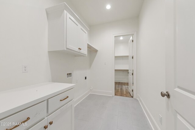 washroom with hookup for a washing machine, hookup for an electric dryer, light tile patterned floors, cabinet space, and recessed lighting