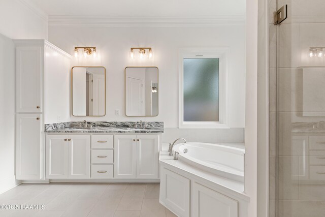 bathroom with a bath, tile patterned floors, a sink, double vanity, and ornamental molding