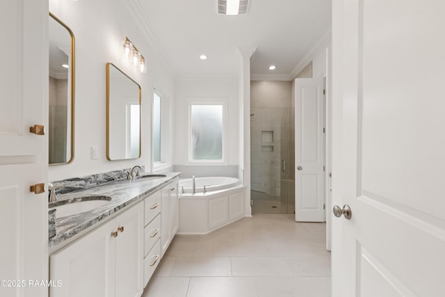 bathroom with tile patterned flooring, visible vents, a sink, and a shower stall