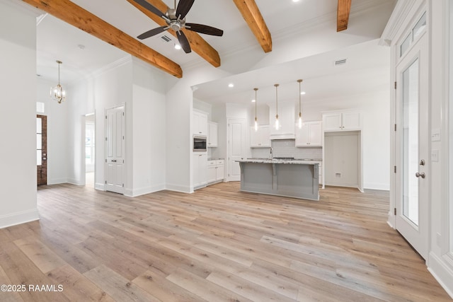 unfurnished living room featuring beamed ceiling, visible vents, light wood finished floors, and recessed lighting