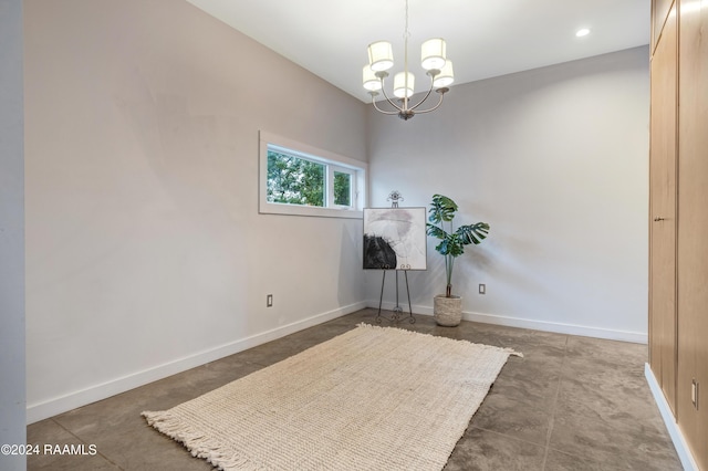 empty room with a notable chandelier