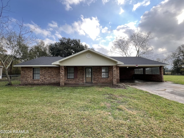 single story home with a front lawn and a carport