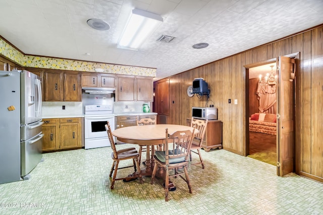 dining area with wood walls