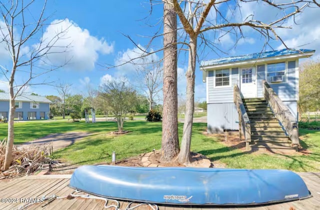 exterior space with a lawn and a deck